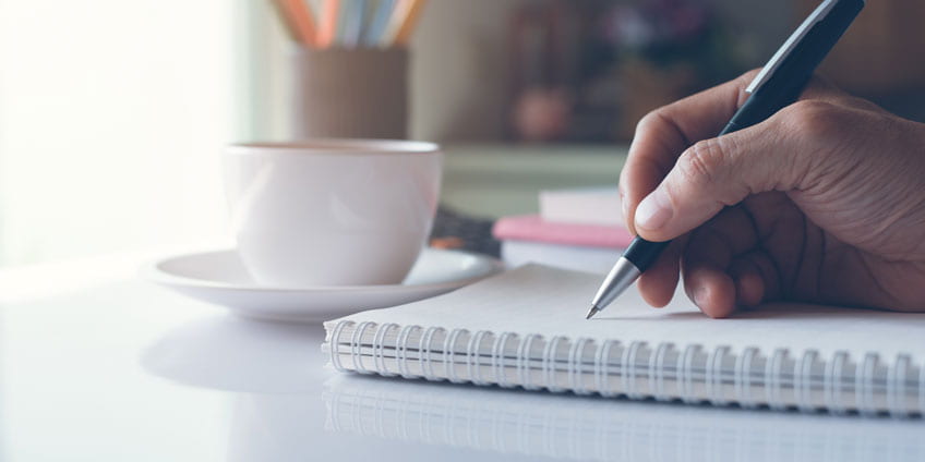 Notebook and pen arranged for a short reflective writing session